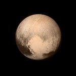 black sky background with large circular light brown planet in foreground